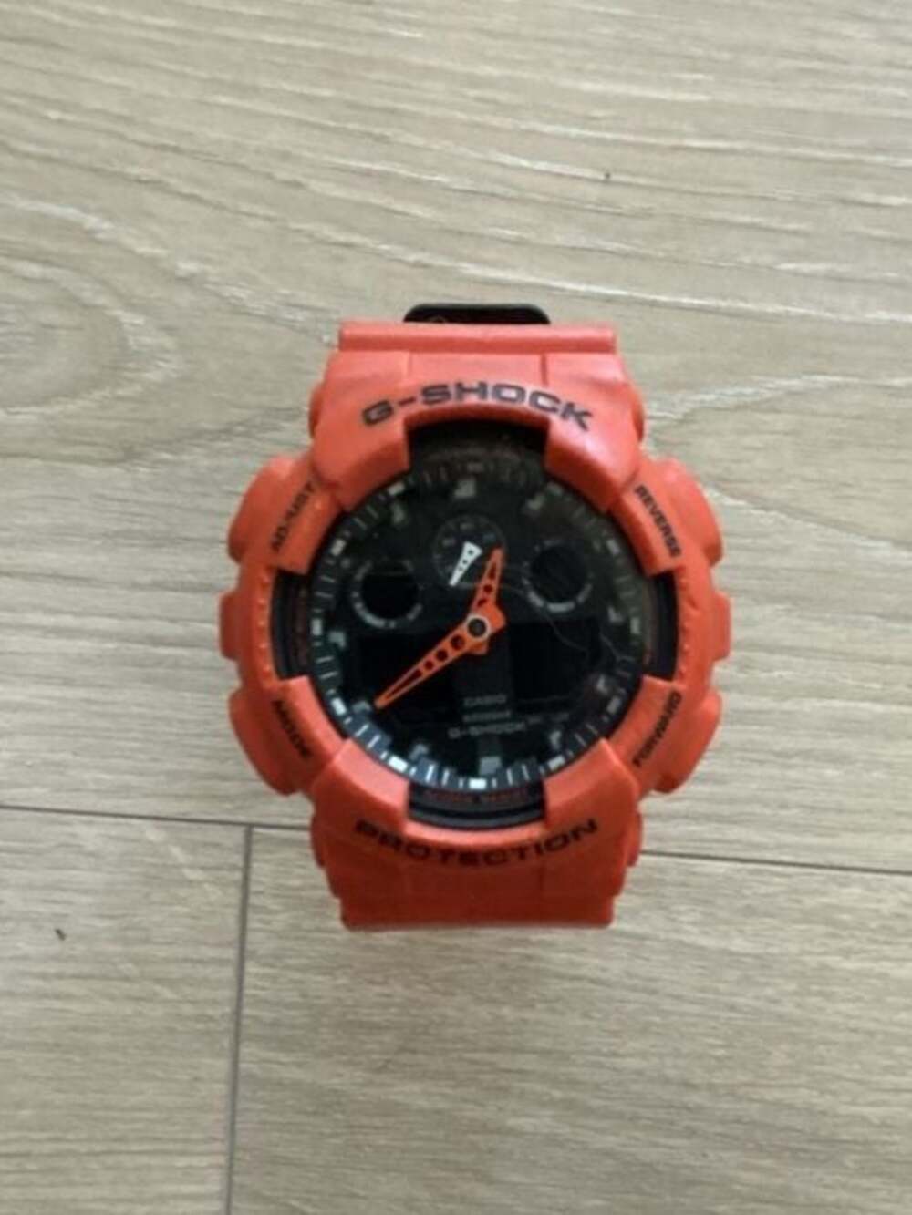 Casio G-Shock GA-100L-4A Layered Color Orange and Black Analog-Digital Watch